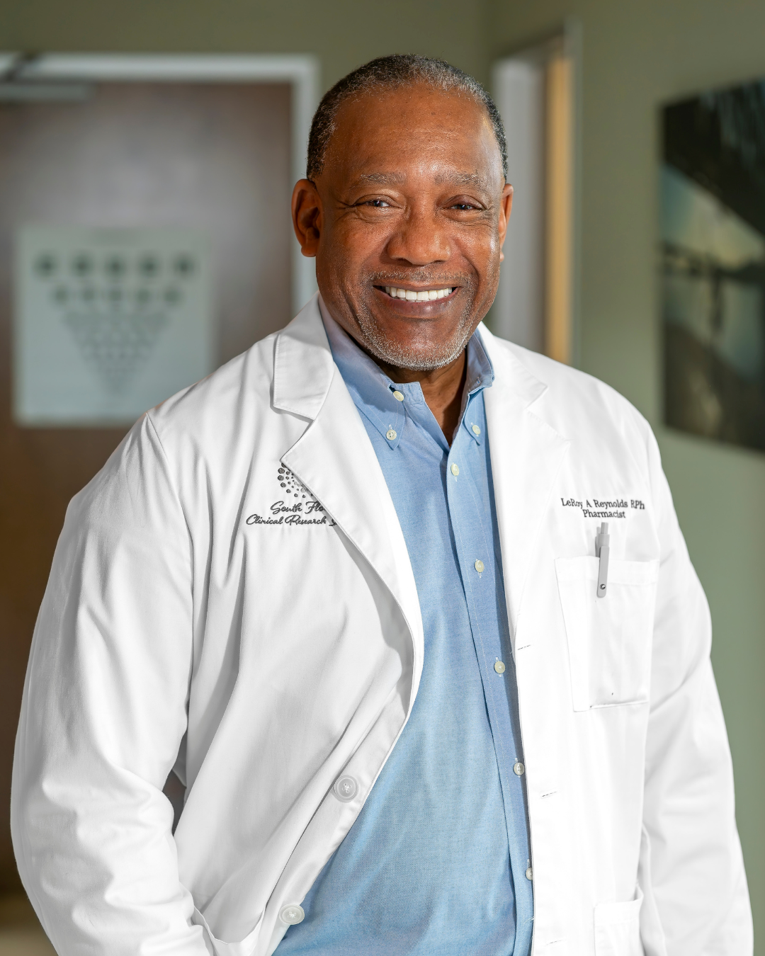 Black male doctor wearing white coat